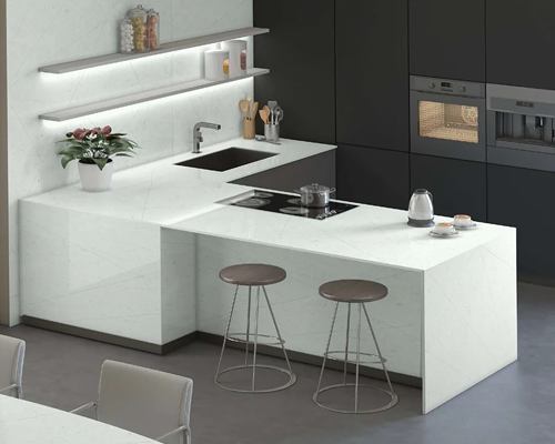 Modern kitchen with table, sink counter all made with white color quartz from Techno quartz